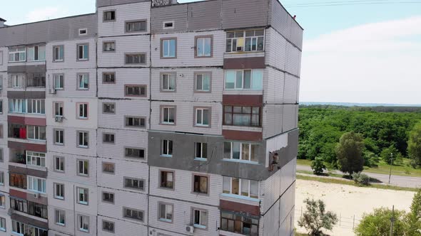 Industrial Climber Painting Building Facade Wall, Insulation Work, Aerial View