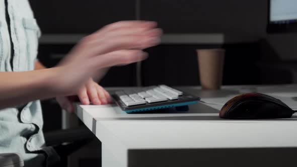 Cropped Shot of a Man Getting in His Chair in Front of Computer and Starting Work