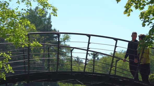 Couple walking on a bridge