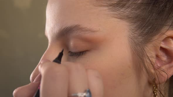 Makeup Artist Making Arrows on Model Face Use Eyeliner Visage Beauty Salon