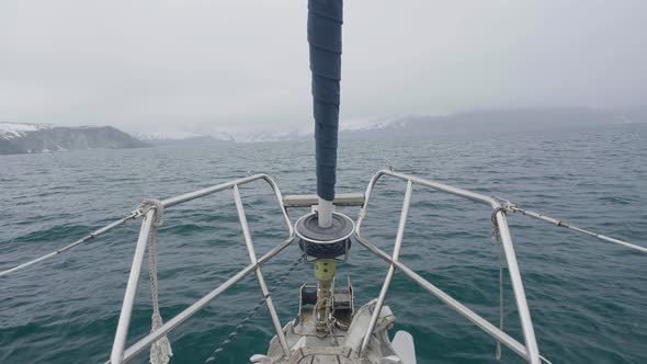 Panoramic View From Bow Sailing Ship on Snowy Mountains Landscape