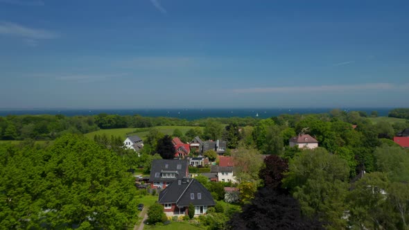 Aerial View Flying Above Residential Suburbs Area in Brodten Germany Drone Rises Up Reveal Amazing