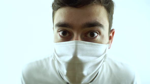 Close Up of Face of Young Caucasian Handsome Man in Medical Mask