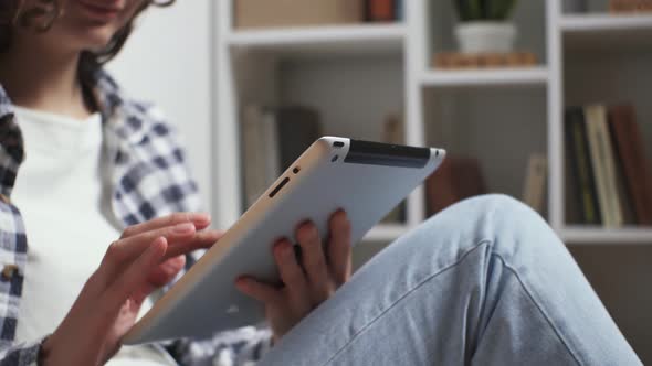 Young Woman In Casual Clothes Having Fun Leisure Time Watching Series On Tablet, Girl Having