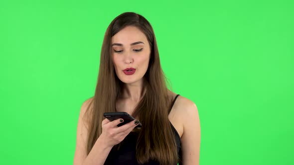 Girl Asks for Information on the Network Via Phone on Green Screen