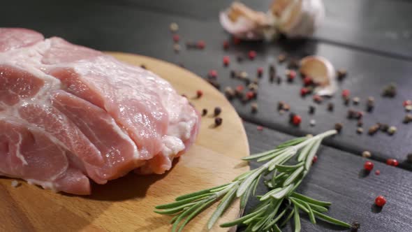 Raw Beef Steak on a Dark Wooden Table