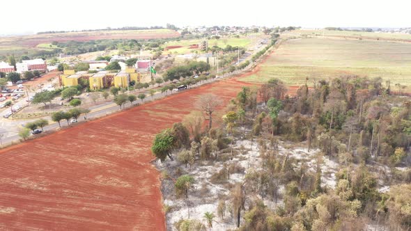 City and burnt vegetation in Campinas, Sao Paulo,  drone shot