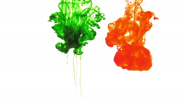 Green And Red Ink Spread In Water