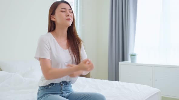 Asian young woman scratch hands feeling suffer and hurt from allergy.