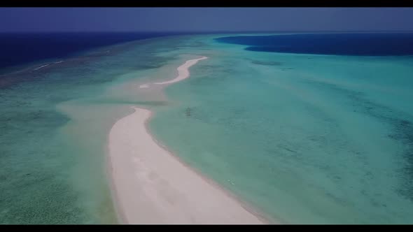 Aerial scenery of paradise island beach journey by blue sea with white sandy background of a dayout 