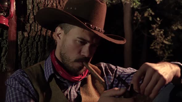 Cowboy with a Cigar in the Forest at Night