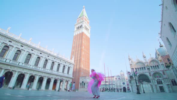 Funny Girl with Pink Dress Jumps and Has Fun in Venice