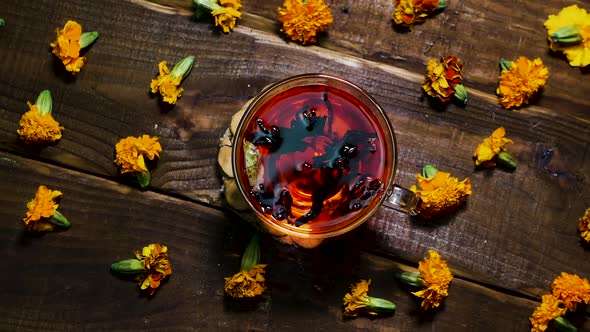 Antioxidant Red Tea On A Wooden Table, Natural From Marigold Flowers, Top View, Tea For Colds.