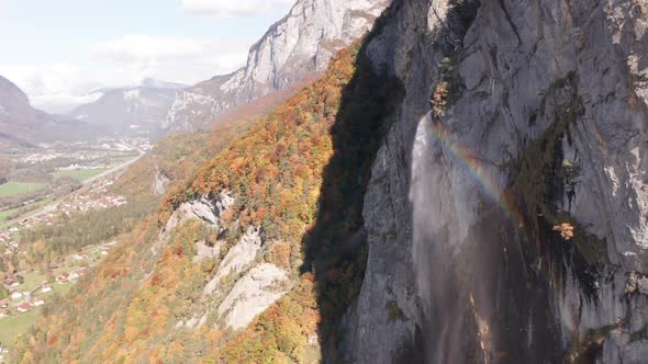 Aerial of rainbow being created by waterfall