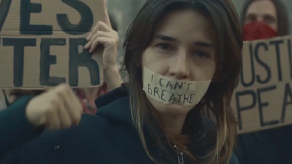 Woman with Words I Cant Breathe on Face at Anti Racism March