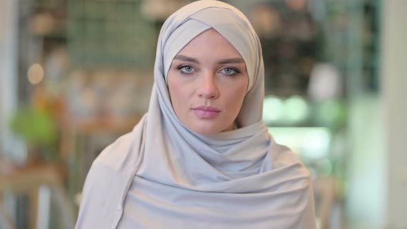 Portrait of Disapproving Young Arab Woman Saying No Head Shake 