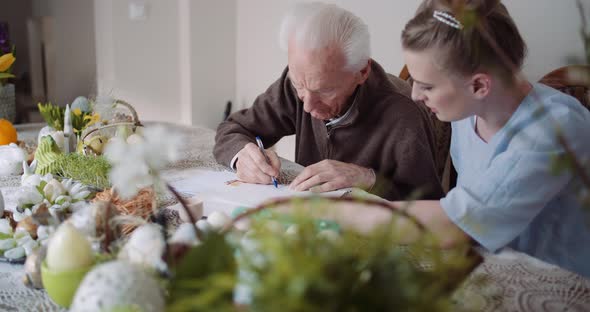 Grandfather Writing Letter During Easter Holidays