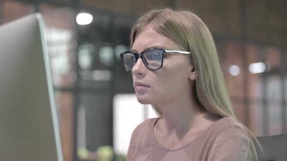 Portrait Shoot of Ambitious Woman Working on Computer