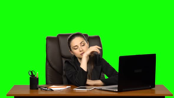 Business Woman in the Workplace Feels Tired After a Hard Working Day. Green Screen