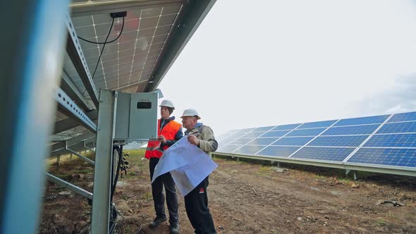 Technicians installing solar panel