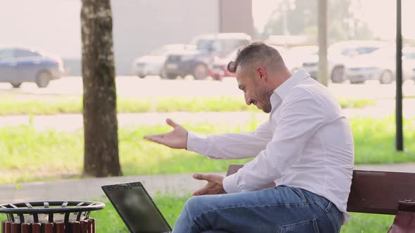 Happy Man in White Shirt Makes Online Profit Counts Dollars Rejoices