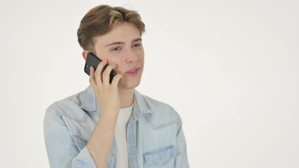 Young Man Talking on Phone on White Background