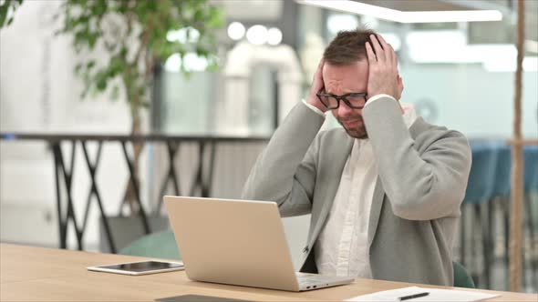 Loss, Creative Man Reacting To Failure on Laptop