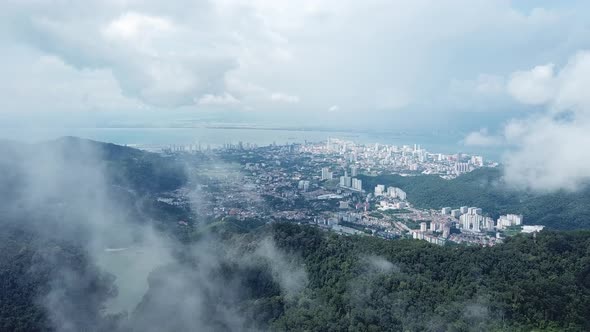 Fly towards Ayer Itam Dam and George Town heritage city 