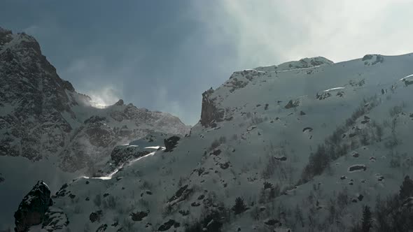 The Wind Blows Snow Off the Cliff