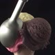 A disher scoop places a strawberry ice cream ball onto a cornette - VideoHive Item for Sale