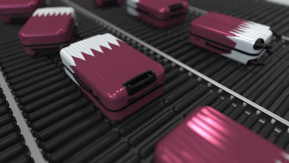 Travel Suitcases with Flag of Qatar on Roller Conveyer