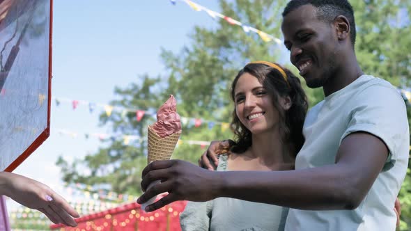 Black Man Buys Icecream Cones and Gives Portion to Brunette