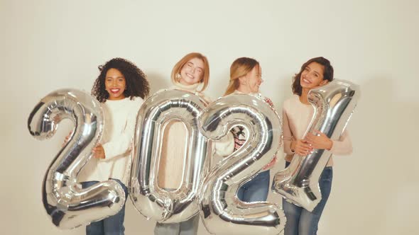 Four Beautiful Women Celebrating New Year