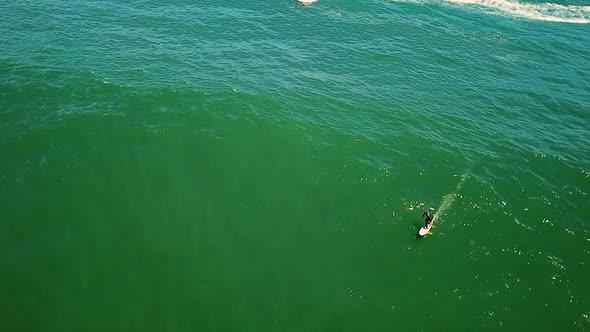 Aerial view of a man surfing near Cape Town, South Africa.