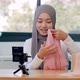 Muslim woman influencer talking and reviewing product cream for sale marketing online - VideoHive Item for Sale