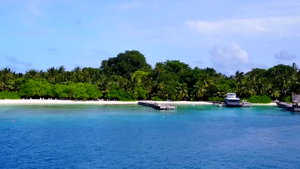 Drone panorama of island beach journey by blue ocean and sand background