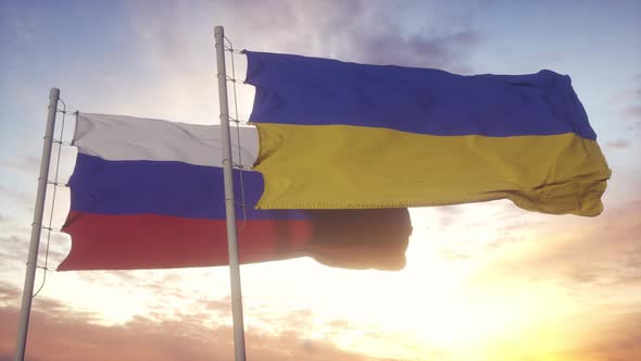 Russian and Ukrainian Flag Waving in the Wind