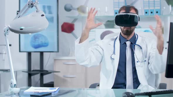 Doctor Wearing a VR Headset Working in Virtual Space in His Moder Office