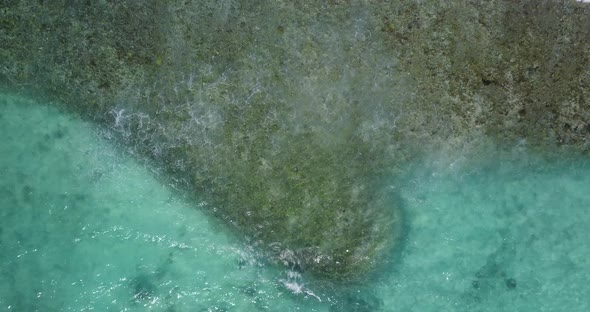 Natural aerial abstract shot of a paradise sunny white sand beach and aqua turquoise water backgroun