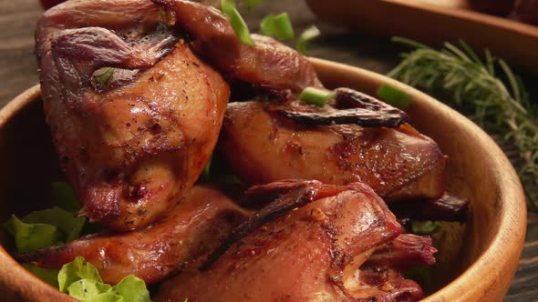 Close-up View of a Wooden Bowl Full of Delicious Fried Quails