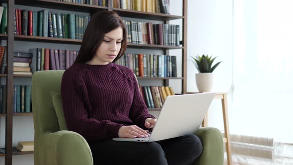 Pensive Woman Thinking and Working in Office