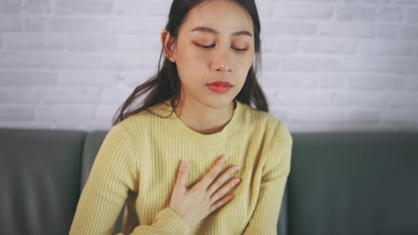 Young Female Suffering From Heartburn