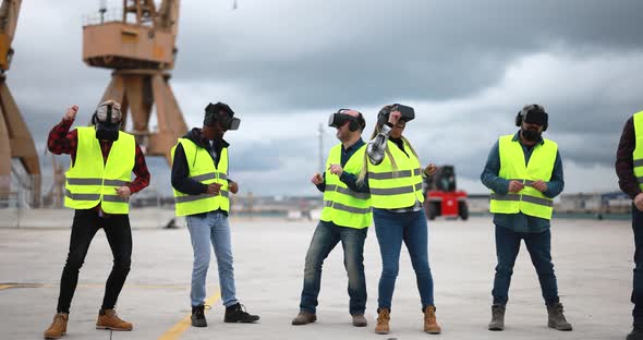 Multiracial workers using virtual reality headsets at industrial terminal Port