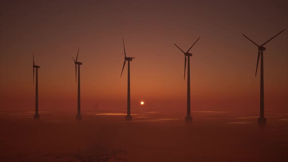 3D animation of offshore wind turbines at sunset. Wind Farm, renewable energy.