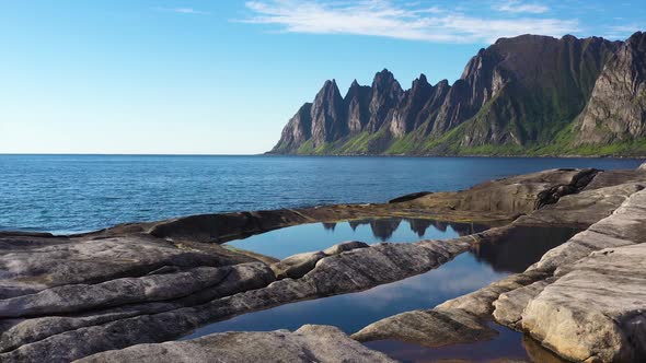 Popular travel destination and Rock Davil’s Jaw in the sunny summer day, Norway,island Senja