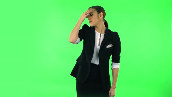 Woman Is Upset and Tired, Takes Off Her Glasses, Green Screen