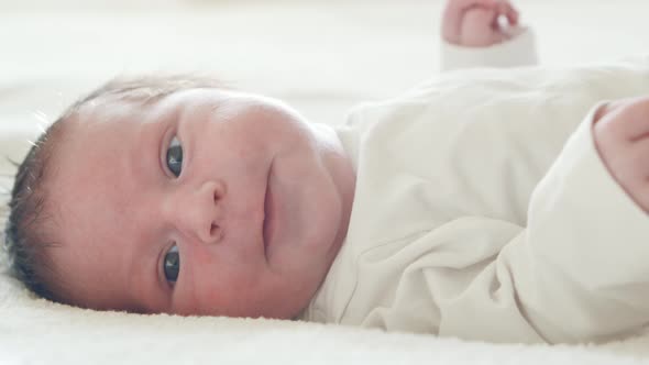 Close-up portrait of a young baby who has recently been born.