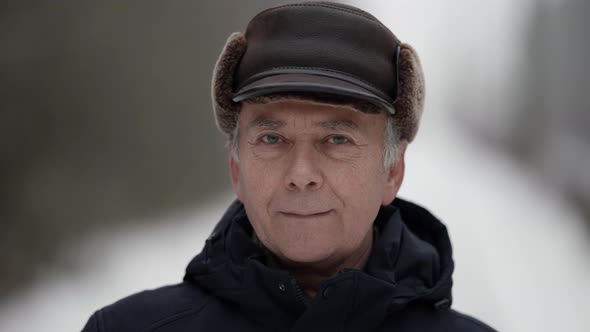 Winter Portrait of Old Man Outdoors Closeup View of Wrinkled Face of Elderly Person