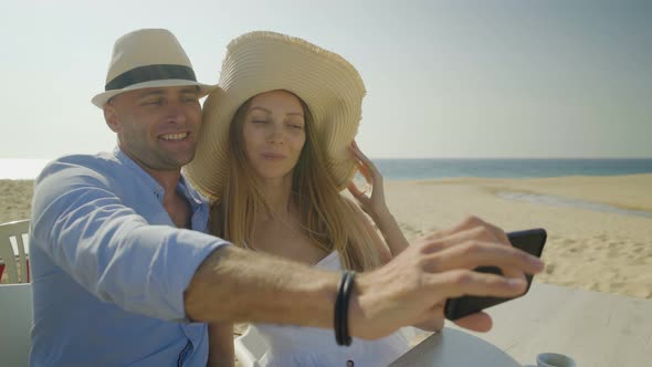 Happy Couple Taking Selfie with Smartphone on Beach