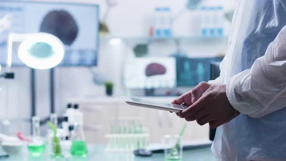 Wide Shot of Researcher Using a Digital Tablet Pad